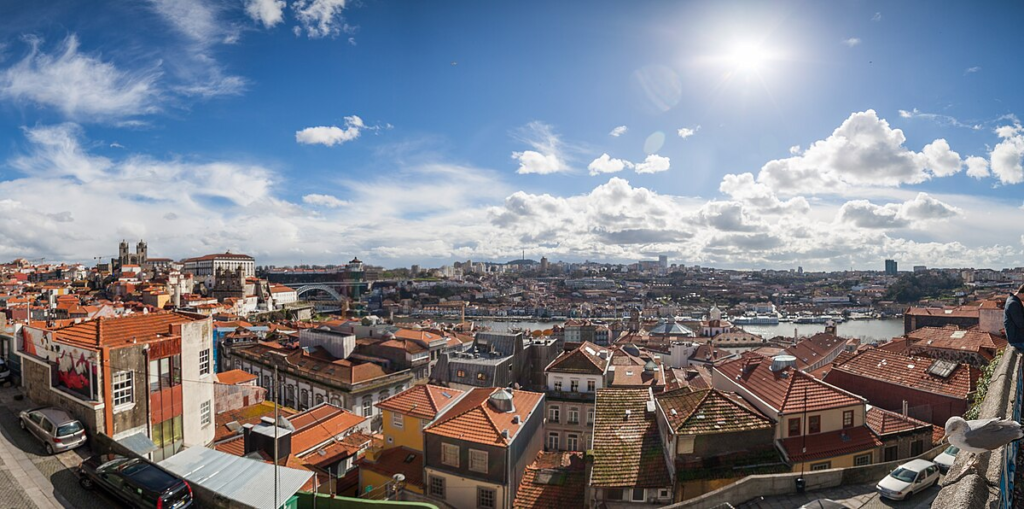 Panoramic view from Miradouro da Vitória in Porto, overlooking the cityscape with historic buildings and the Douro River.