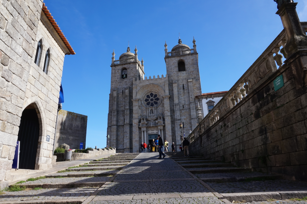 Stunning view of the Porto Cathedral, a historic Romanesque and Gothic landmark, under a clear blue sky.